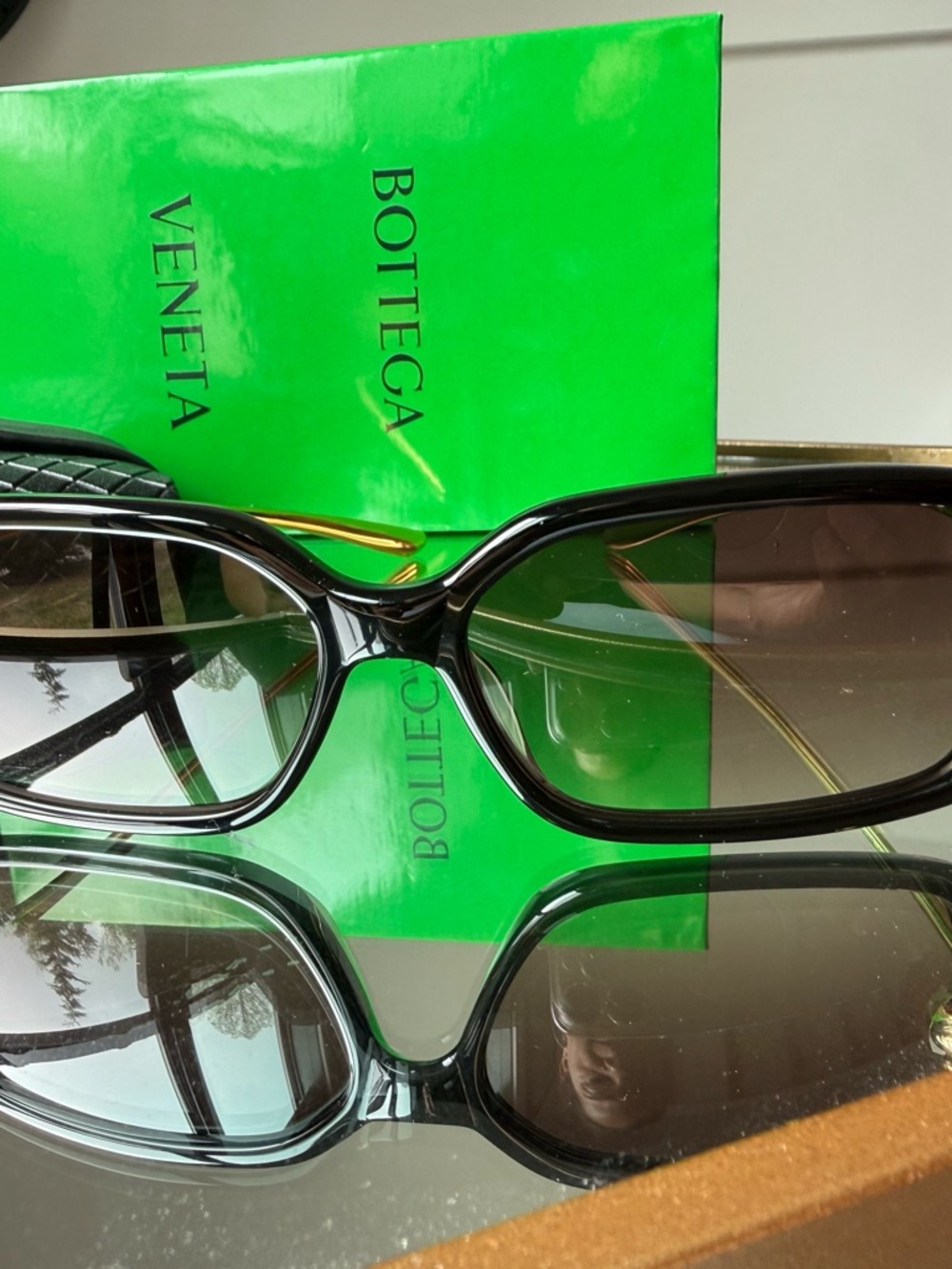 Bottega Veneta Black Frame Sunglasses with Gold Temples